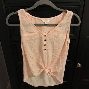 sleeveless pink blouse